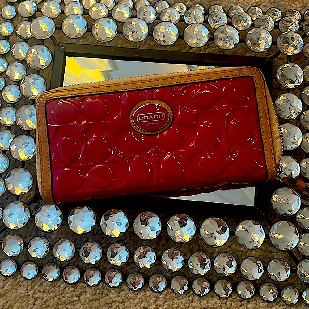 Pink and tan coach wallet.